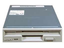 An image of a grey floppy drive in a computer as an example of a secondary storage device.